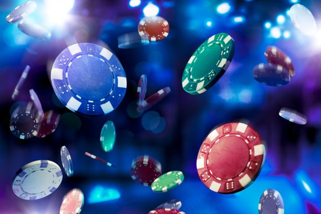 Poker,Chips,Falling,With,Dramatic,Lighting Online poker